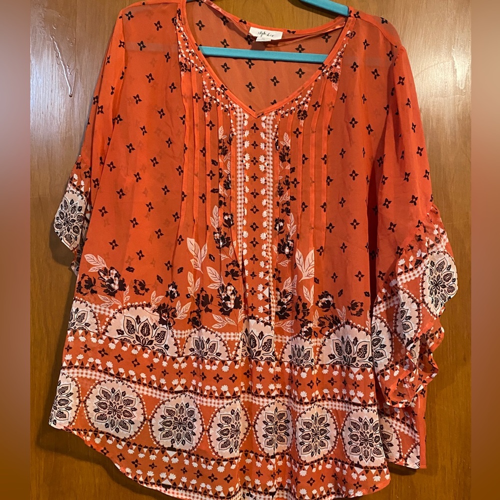 Cute float top in orange, kinda see-through size extra large